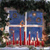 A static pixelated image shows a window with four panes, blue sky, and red vertical elements below, against a dark background.