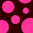A static image of pink circular shapes of varying sizes on a dark brown background with no visible text or additional elements.