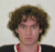 A person with curly brown hair appears in , some overlaid with red star symbols containing the number 2, while other frames show pixelated or blurred variations of the same individual