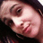 Pixelated close-up of a person's face with dark hair, light skin, and a neutral expression, cropped to show only the upper face and part of the neck.