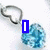 Animated sequence showing a heart-shaped pendant with blue gemstone changing text from 'I' to 'Love...' then 'Him'.