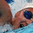 A pixelated image shows a person with light skin and dark hair lying down, next to blue text reading 'I <3 2 SWIM' and 'because of... hot guys friends fun, and hot guys'.