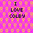 Pixelated text "I LOVE COLBY" on a pink background with yellow circular patterns, repeated in a