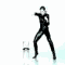 A pixelated figure in a black bodysuit performs a martial arts pose with one arm extended forward and the other pulled back, standing on a light blue reflective surface.