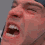 Four pixelated close-up views of a person's face with mouth open in a shout, arranged in a against a gray background