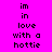Pixelated text on bright pink background with cyan highlight boxes, displaying 'im', 'in', 'love', 'with a hottie' in black font across multiple