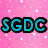 Pixelated icon divided into four quadrants with text and imagery: pink glitter background with 'SGDC', teal background with 'junior company', legs in black shoes, purple with 'DANCE'