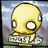 Pixelated yellow cartoon character with large white eyes and a blank expression, standing on a base with partially visible text against a blurred background.