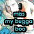 Pixelated image with blue text reading "I miss my buggo boo" over a blurred background featuring indistinct figures and colors.