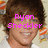 Pixelated image of a person with brown hair and light skin, wearing white clothing against a blurred background.