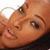 A person with dark hair and light brown skin appears in a of four showing subtle facial expression changes