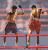 Animated sequence of two shirtless men in red and blue shorts boxing inside a ring with red ropes.