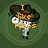 Pixelated character with green skin, white eyes, and a brown hat displays text above its head against a dark green background.