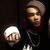 Pixelated static image shows two figures: one with white hair and light skin, another with brown hair and dark clothing against a black background.