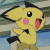 Four of a yellow cartoon character with black-tipped ears, pink cheeks, and a red mouth, standing against a striped background