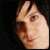 Two side-by-side pixelated frames of a person's face with dark hair and light skin, displayed as an animated contact sheet.