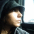 Pixelated static image of a person with light skin tone, dark hair, and closed eyes in profile view against a dark background.