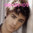 Pixelated close-up of a person with dark hair and light skin, overlaid with pink digital date text.