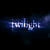 Pixelated blue and white text on dark background with blurred light effects.