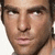 A pixelated close-up of a person's face with subtle variations in expression and background across four