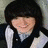 A pixelated image shows a person with dark hair and light skin wearing a white-collared shirt under a dark vest, next to bold black text reading "He's Mine" on a white background.