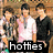 Three pixelated figures stand side-by-side against a brown textured background, with text reading 'hotties' in white letters on black at the bottom.
