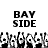 Black and white pixelated text "BAY SIDE" above a of repeating cartoon characters with raised arms