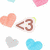 Pixelated heart-shaped icons in pastel colors with brown text reading 'Love' and 'Hearts', arranged on a white background.