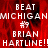Red background with white pixelated text reading 'BEAT MICHIGAN #9 BRIAN HARTLINE!!' repeated in two vertical , one partially obscured by a gray rectangle