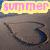 A beach scene with a heart drawn in sand, featuring text overlays that change across frames.