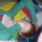 Pixelated image of a character with light skin, yellow hair, and a red headband, holding a brown object against a teal background.