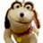 Pixelated dog-like character with brown ears and red collar on left; blue background with pixelated text blocks on right.