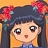 Pixelated character with dark blue hair, red flower accessories, and a blue top against an orange background.
