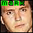 Pixelated face with green text 'mARK' above, showing subtle animation change in facial expression.