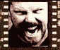 A filmstrip-style of 24 monochrome facial expressions in sepia tones, each frame bordered by perforated edges