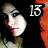 Pixelated image of a person with light skin and dark hair, wearing red lipstick, next to large white numerals '13' on black background.