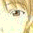 A pixelated close-up of a light brown-haired figure's face with visible eyes and nose, showing sequential text changes from 'I' to 'IK' in bright pink.