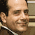 A pixelated image of a smiling man in a suit with 'MONK USA network' text overlays on blue and gray backgrounds.