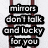 A static image shows dark red vertical bars with black text on a light gray background, displaying two phrases.