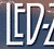 A contact sheet of two animated frames showing stylized text logos against gradient backgrounds with visible pixelation and anti-aliasing effects.