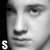 A black-and-white animated sequence shows a person's face with text evolving from 'S' to '$lytherin', each frame adding letters and changing the final character color to green.