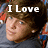 A pixelated image of a person with brown hair wearing a gray shirt, with text overlays reading "I Love Ryan" and "Sheckler <3" in white font.