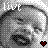 Pixelated grayscale image of a stylized face with visible text 'LIVE' in the upper left corner and a small red heart symbol at bottom right.