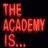 Red pixelated text on black background reads 'THE ACADEMY IS...' with a red heart symbol '<3' below.