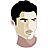 Pixelated portrait of a person with short black hair, light skin, and a neutral expression wearing a brownish-red shirt against a gray background.