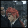 Animated sequence of a character with red spiky hair and dark suit turning head from side to side, ending on text "You Talkin To Me?".