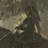 Pixelated static image with dark central mass and light beige patches against a muted brown background.