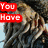 A pixelated image of a character with long brown hair and dark clothing, overlaid with red text boxes displaying partial phrases.