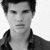 Pixelated grayscale portrait of a person with short dark hair wearing a collared jacket over a light shirt against a white background.