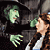 A 50x50 pixel animated contact sheet showing two frames of a Wizard of Oz scene with the Wicked Witch and Dorothy, alongside green text reading "Original Icons .com" on a dark background.